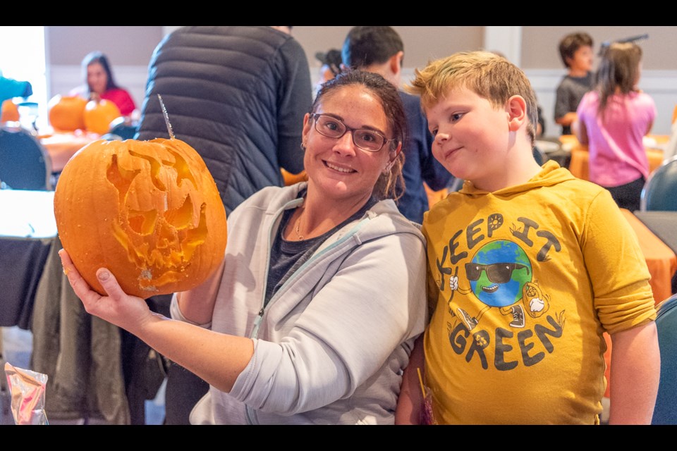 Hawghian family and their pumpkin.