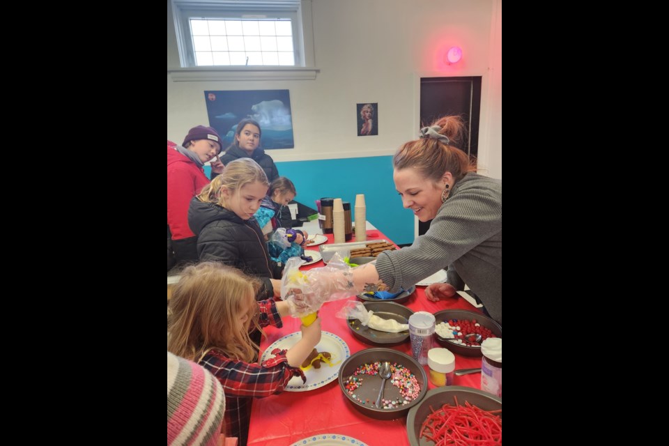 Ma and Me Bakery owner, Jenn Belcher, was kept busy for six solid hours decorating 289 gingerbread men with children as part of Unity's Winter Wonderland festivities.