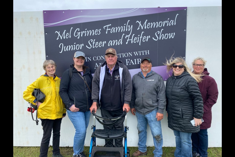 From left, Arcola fair committee members Autumn Downey and Lisa Pittman, Arcola fair livestock judges Frank Eaton and Calvin Fornwald, donator Stacey Grimes Wempe, Arcola fair committee member Judy Naylen