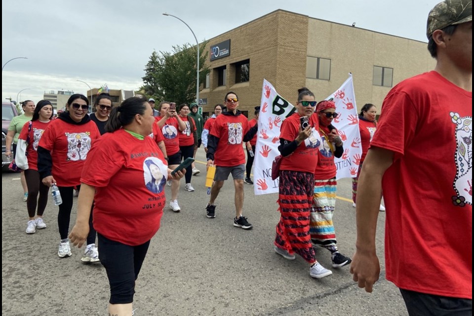 Ashley Morin's sister Janine Morin, centre left, joins in the walk for Ashley on July 10, 2025.