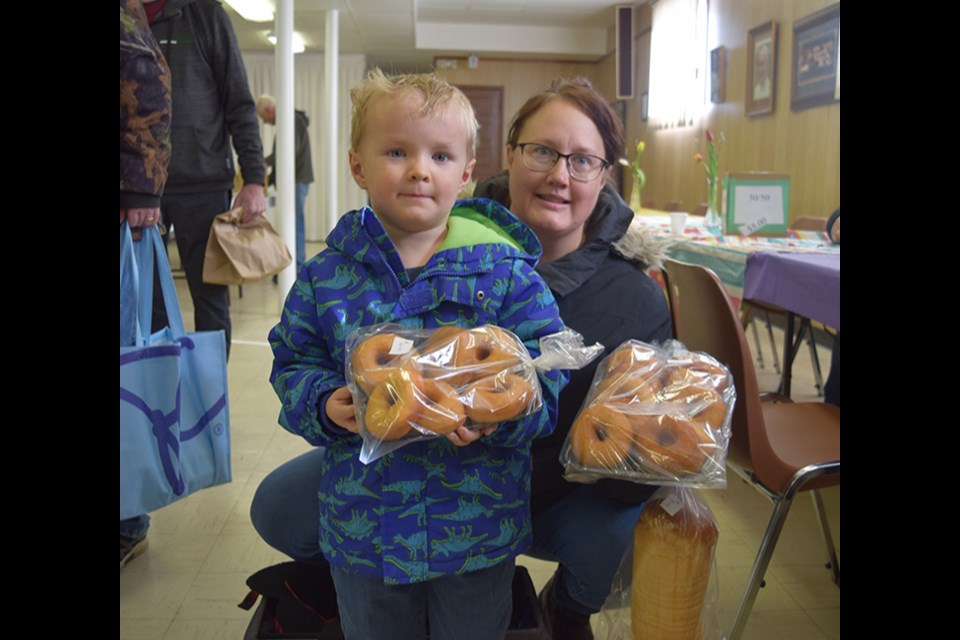Megan Shewchuk and her four-year-old son Milo were among the first in line for the Easter Tea & Bake Sale at the Canora Ukrainian Catholic Hall on March 21, and therefore had the best selection. They were excited to take home: doughnuts, bread and a variety of “fancy cookies.”