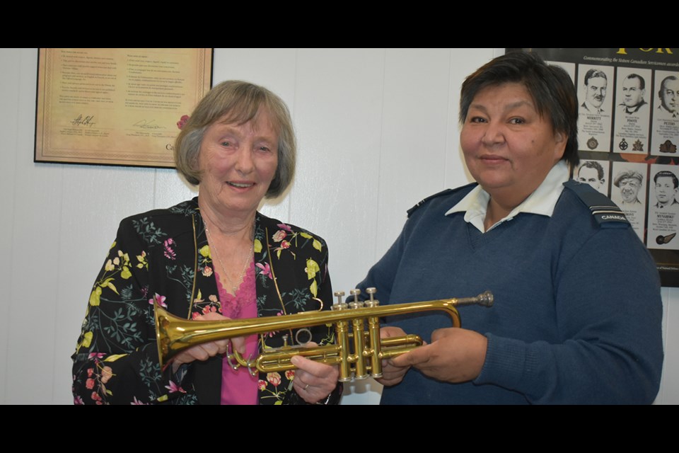 Margaret Ratushny, widow of the late Paul Ratushny, donated the trumpet that her husband had used to play at Kamsack Legion functions for over five decades. With her was Karen Tourangeau, Legion branch president. 