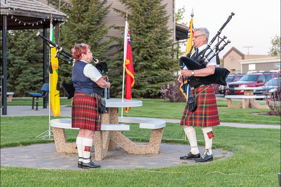 Linda Lyon-Walls and Jim Ramsay start the evening off playing the song Diu Regnare (Long to Reign) after Tim Popp, vice-president of Battleford Legion Branch #9, gives some opening remarks. Diu Regnare is a unique tune specially written for the occasion by Pipe Major Stuart Liddel, the world's leading piper. 