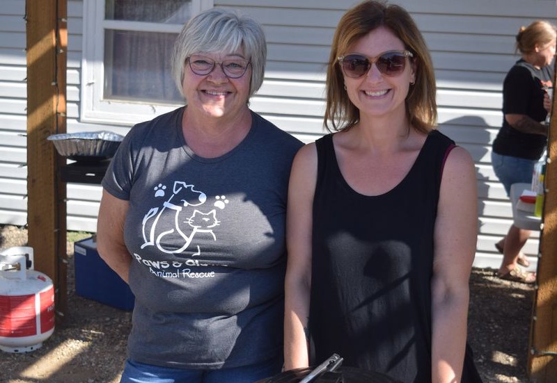 At the Paws & Claws breakfast outside the CN Station House Museum on Aug. 20, Joanne Ottmann (left) and Crystal Reine were two of the volunteers who helped make sure everyone had plenty of food.