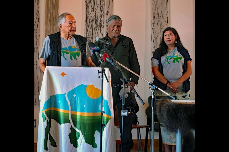 University of Lethbridge professor emeritus Dr. Leroy Little Bear, left, introduces elder William Badger, right, who delivered the opening prayer during the Buffalo Treaty signing on Friday, July 15, at Wanuskewin Heritage Park.