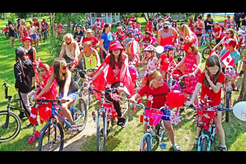 Children ready for the Canada Day bike parade lined up to go on Friday morning at Nickle Lake Regional Park.