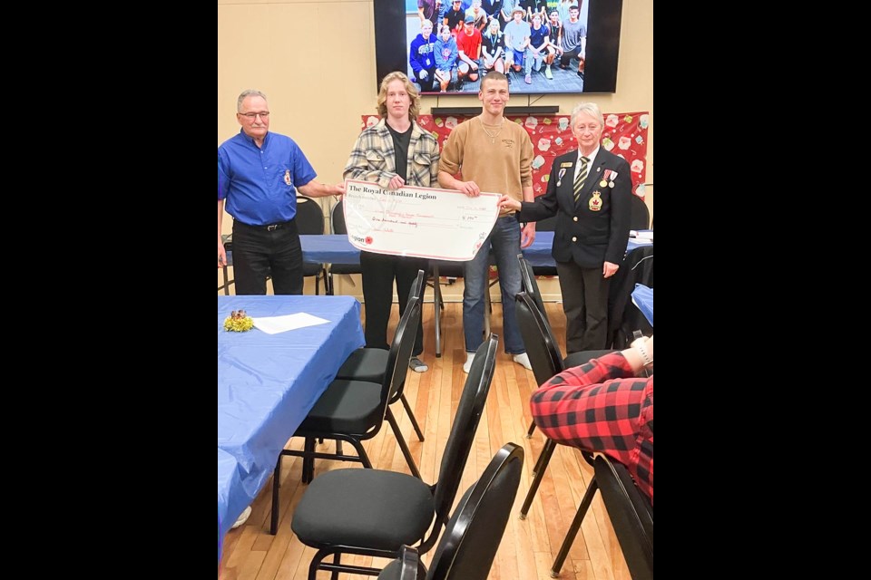 From left, Carlyle legion member Gerald Clark, athletes Liam Thompson and Sawyer Tomaszewski, and legion member Nedra Clark. 