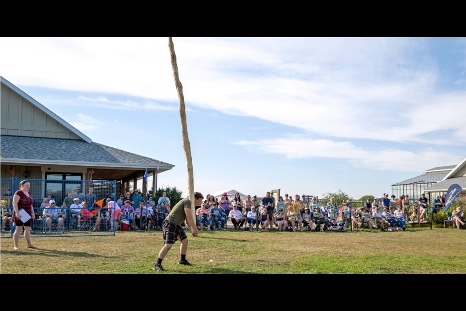 Liam Hingston competing in the caber toss.