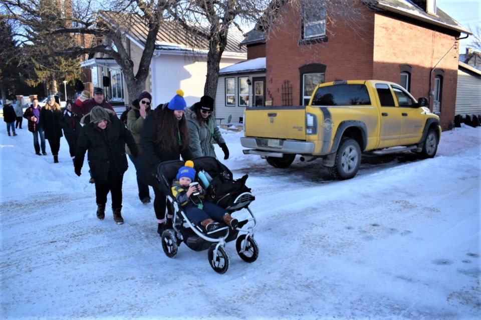 Participants in the Choose Life Ministry Coldest Night of the Year Walk head down Second Street in Estevan. 