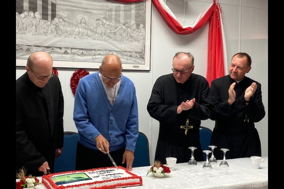 The cake with a picture of the 1921 church was cut by Rev. Michal Pajak, Archbishop Don Bolen, Rev. Andrew Sowa and Rev. Mitch Burdzy.
