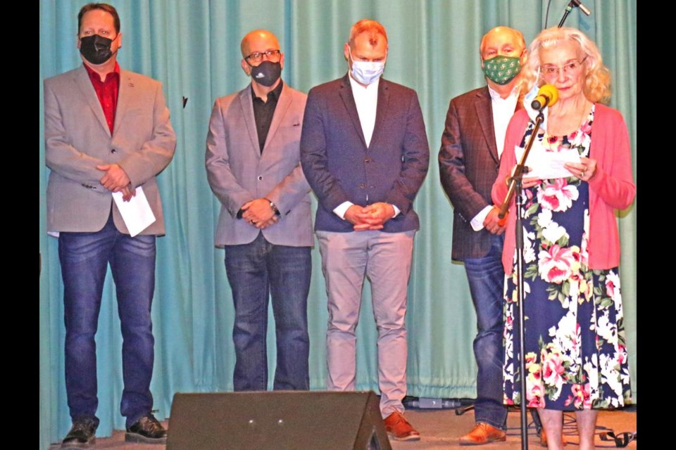 Local writer Jean Fahlman read her annual Communithon poem, in honour of its 40th anniversary, as behind her Reeve Norm McFadden, Coun. Jeff Richards, MLA Dustin Duncan and MP Robert Kitchen listened.