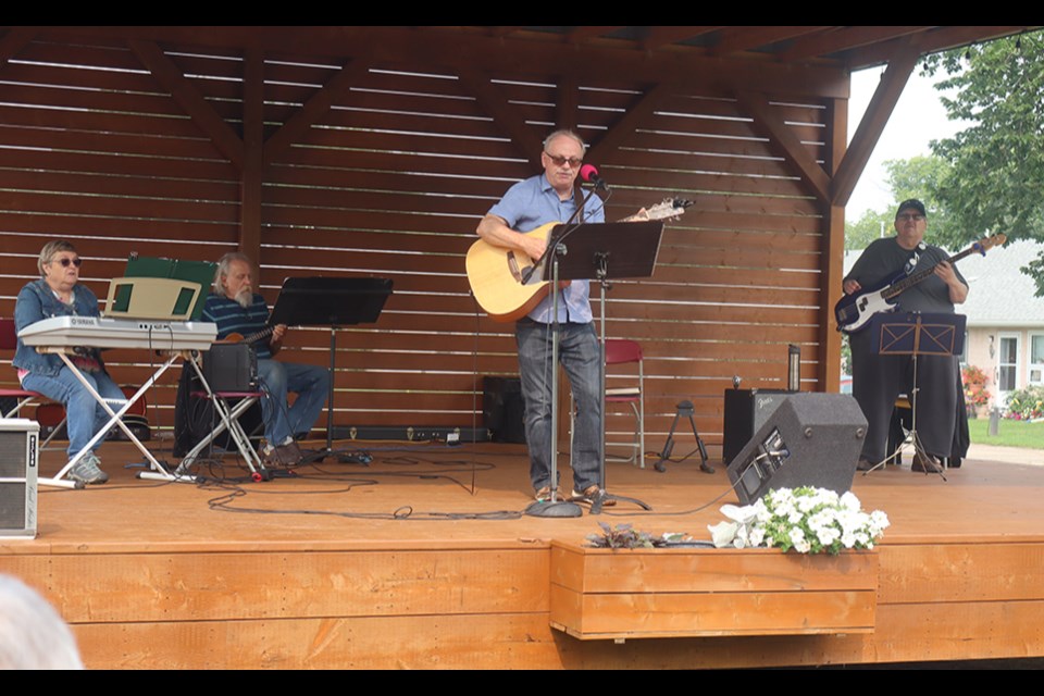 The music of the non-denominational church service filled the air on Aug. 10 as part of the Canora Community in Bloom Week. Musicians were, from left: Carolyn Bright (keyboard), A.J. Bathgate (tenor ukulele), Greg Bright (guitar, vocals) and Wes Popoff (bass). 