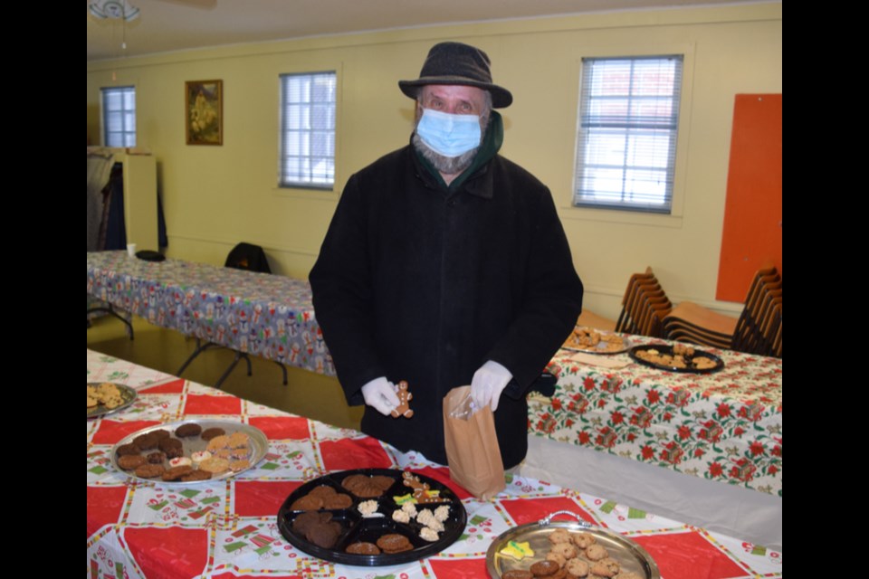 Doug Daniels appeared to be pleased with the assortment of cookies available at the Canora United Church Cookie Walk and Frozen Perogy Sale on Nov. 30.