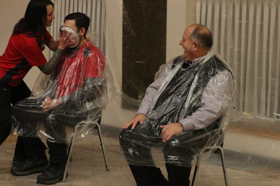 Legacy Co-op General Manager Bruce Thurston (right) and Dillon Zolkavich, Palliser Way Manager (left) recieved a pie in the face as a result of the fundraising efforts by their staff.