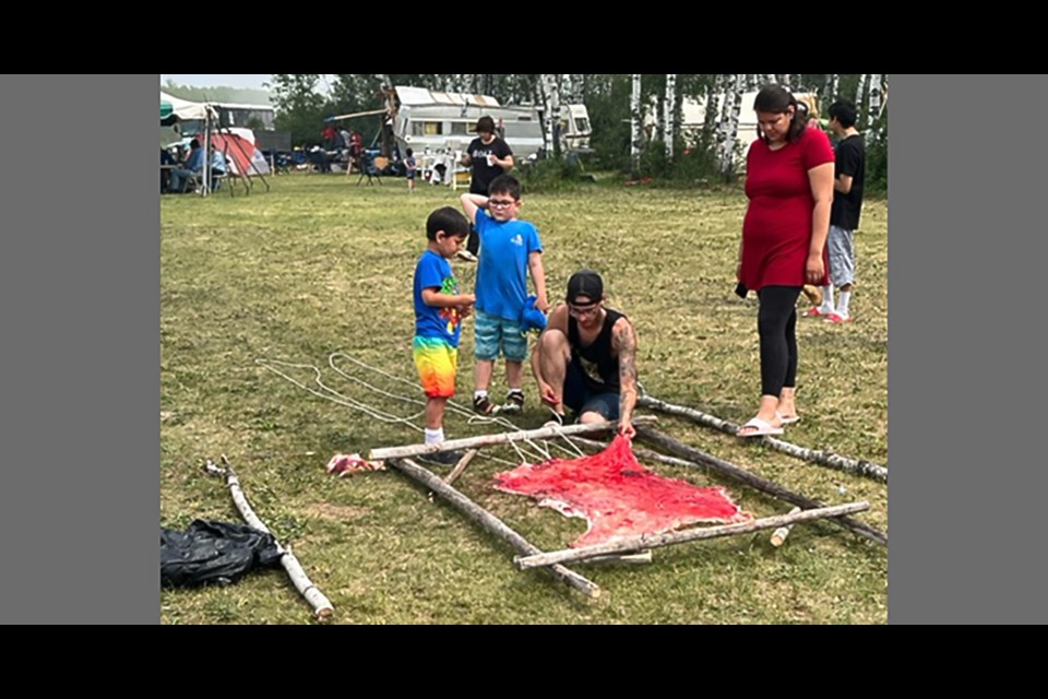 Among the tasks learned was how to stretch a hide onto a frame for further processing.