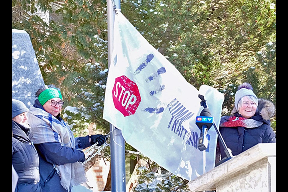 Catholic Women's League of Canada Saint Anne Parish Council members prepares to raise the flag.