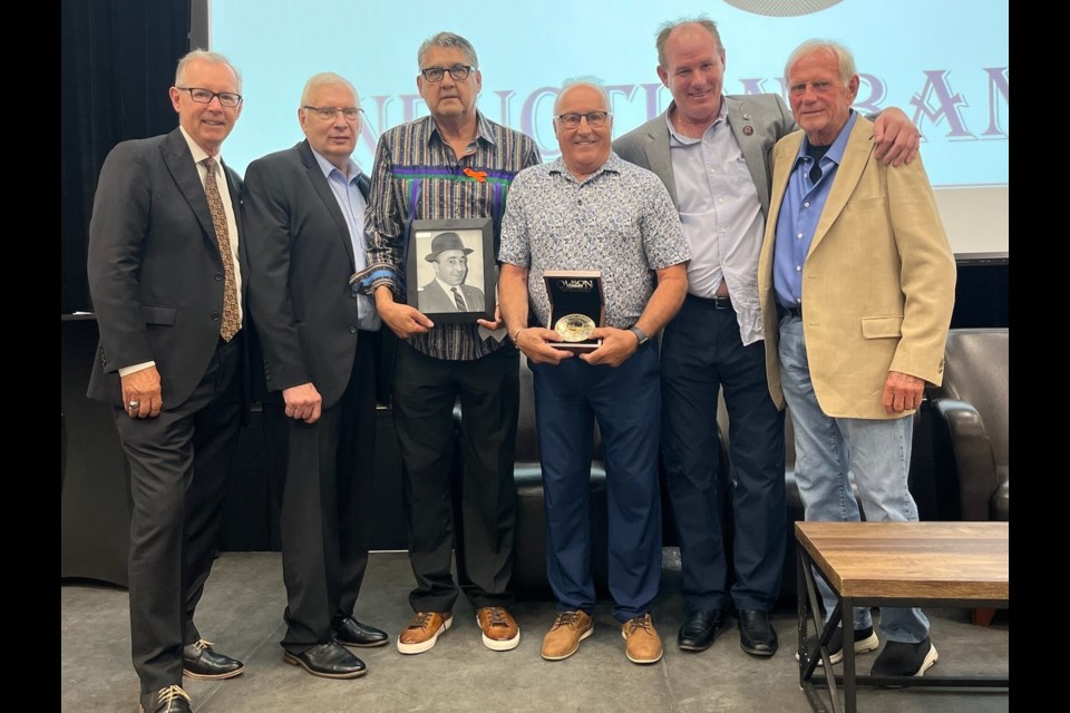 David George posthumously accepts the award for his father Albert "Jeep" George. Pictured, from left to right, Dennis Beyak, Garth Malarchuk, Ron Delorme, David George, Tim Lenarndon and John Chapman. Dennis TV broadcaster Winnipeg Jets, Garth Malarchuk goaltender Toronto Maple Leafs, Ron Delorme Vancouver Canucks player and chief scout, Tim Lenardon, Scout and John Chapman coach Centennial cup champs, Western hockey league and memorial cup champs, Philadelphia Flyers chief scout. They are all either directors or board members.