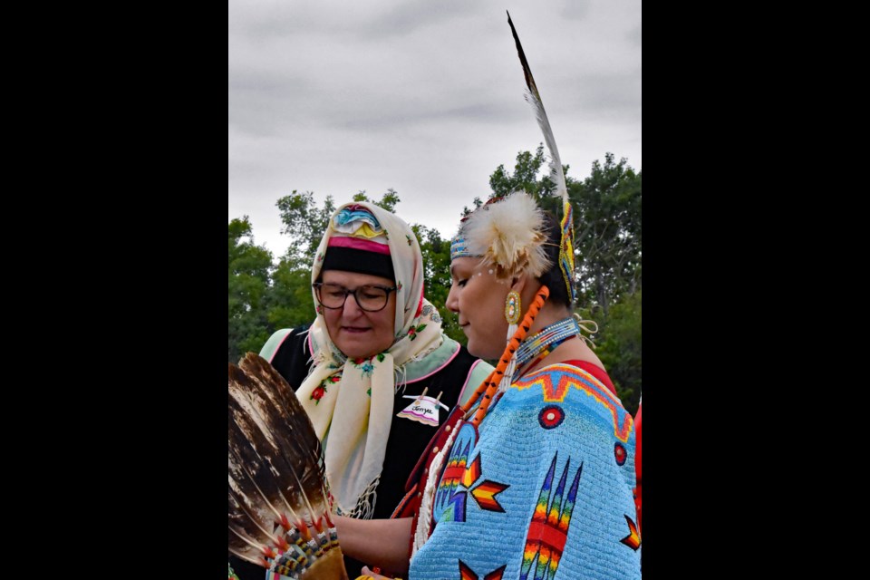 Jeanette Stringer, left, talks with Kimowan Ahenakew of the Ahtahkakoop First Nation during last week's event at the Doukhobor Dugout House near Blaine Lake.