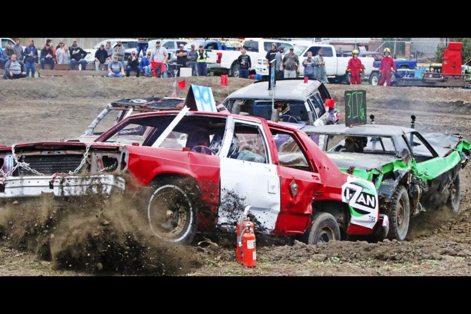 A car threatens to jump the barrier during the "Fall Brawl" demo derby on Sunday, put on by the Weyburn Ag Society.