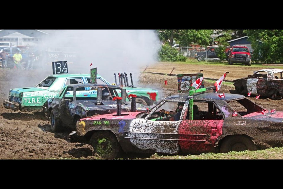 These were the competitors in the first heat of the demo derby, and they had to contend with extremely muddy pit conditions.