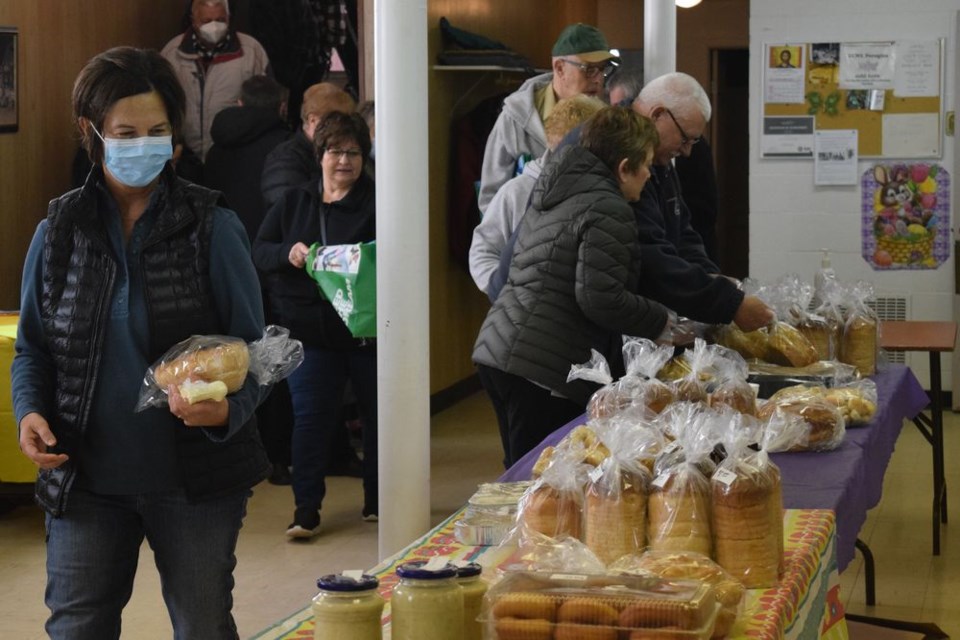 Shoppers from Canora and the surrounding area looking for homemade baking lined up to get the best possible selection at the Ukrainian Catholic Women’s League Easter Bake Sale held at the Ukrainian Catholic Hall on April 7. Items available included: nalysnyky, sweet & sour cabbage rolls, buckwheat cabbage rolls, perishke, babas, clam chowder, beet relish, horseradish, paska, four different kinds of perogies, and even butter in a lamb mould.