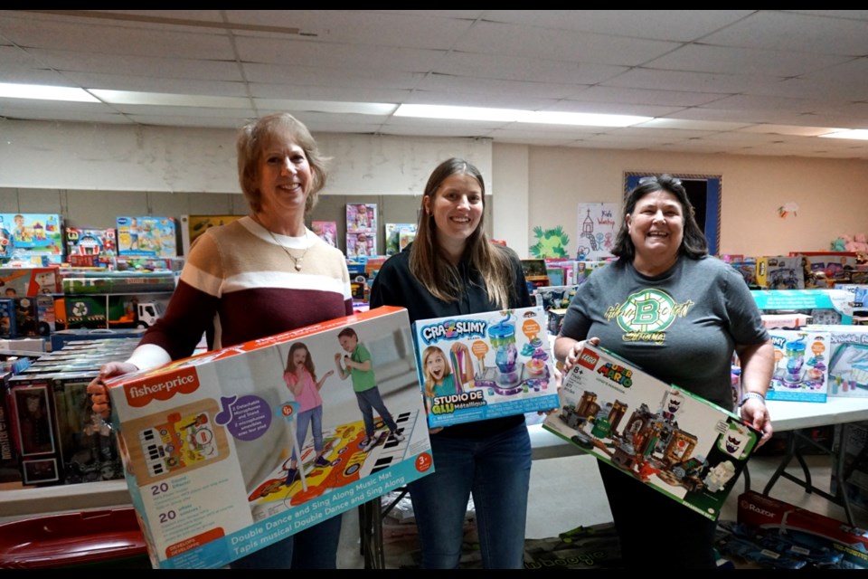 Shelley Dayman, Jolie Bayda and Debbie Wade were organizing the Community Hamper Association's Angel Tree Toy Store ahead of "shopping" days.                               