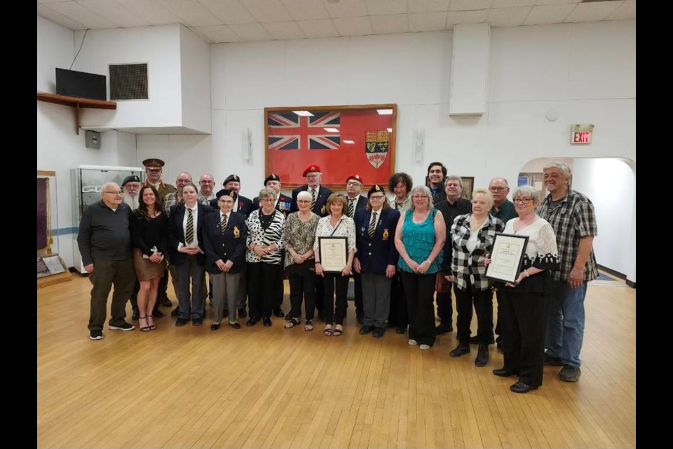 Award recipients gather for a group photo. 