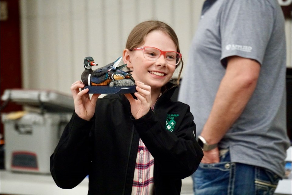 Peyton Van De Woestyne helped the Estevan Wildlife Federation with displaying live auction items.