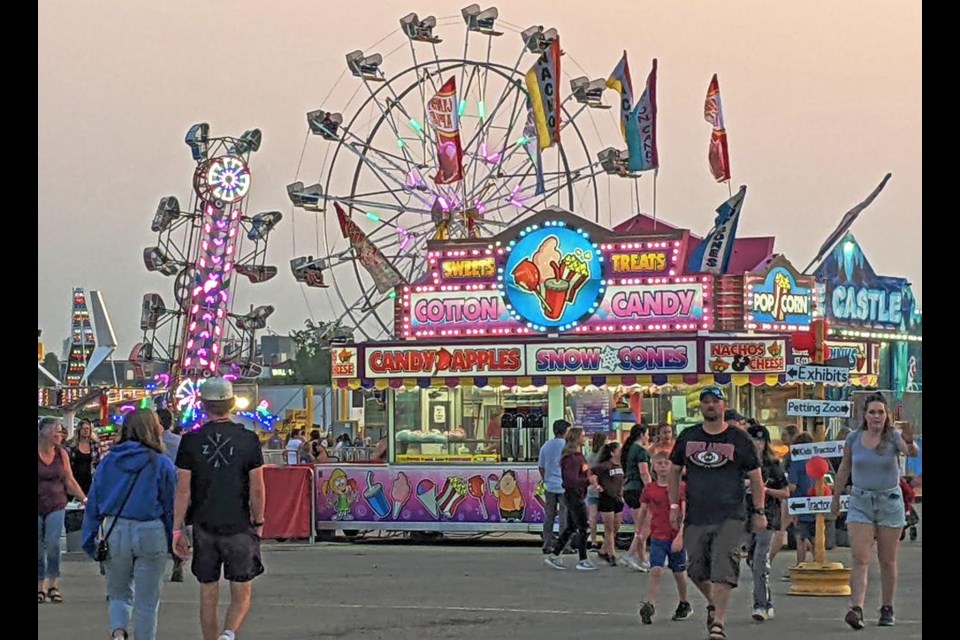 Warm summer evenings helped keep the rides and games busy at the Weyburn Fair as dusk fell.