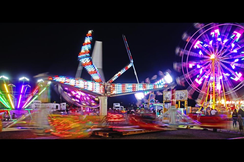 A wide view of the midway showed a variety of rides from the Zipper to the Orbiter and the ferris wheel at the Weyburn Fair.