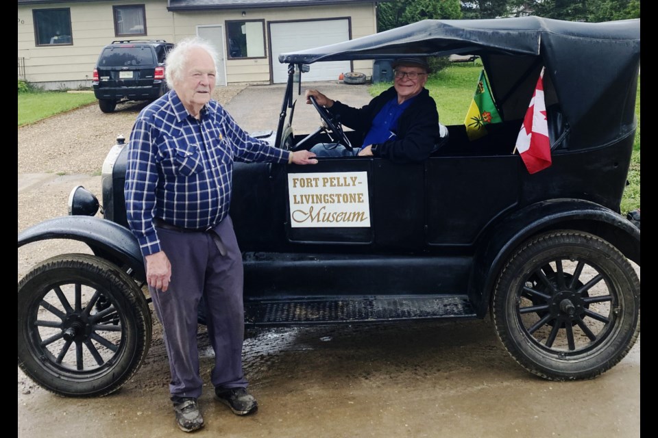 Merv Abrahamson and driver Fred Konkin posed with the Model A.