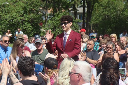 Michael Desrosiers waved to the audience as he was introduced during the entrance at CCS graduation on June 26. Higher education is in the cards for his future.