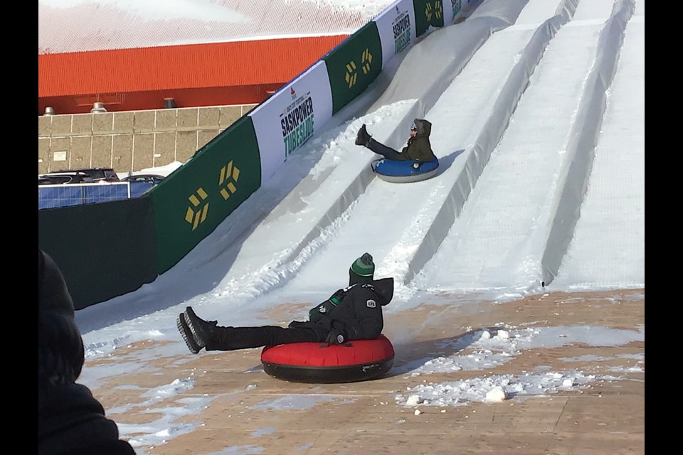 One highlight of Thursday at the Grey Cup Festival was the opening of the massive Tube Slide. Seen here, Mayor Sandra Masters and Riders CEO Craig Reynolds took part in a tube race.