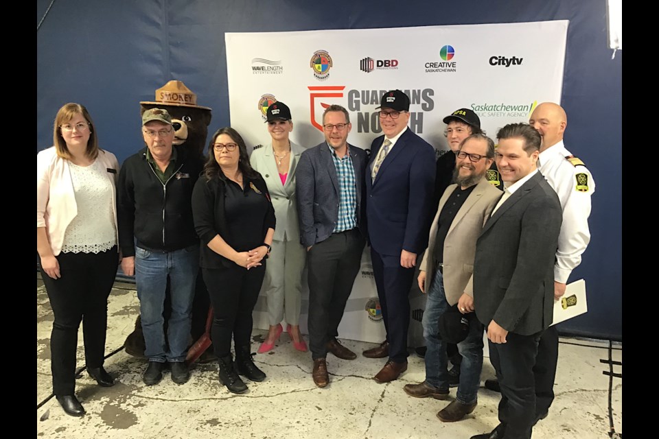 Premier Scott Moe and minister Christine Tell are surrounded by backers and participants in the new TV docuseries Guardians of the North.
