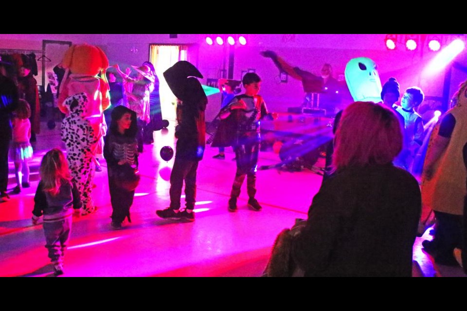 Coloured lights and dance music filled the air at Dominic Place for the Halloween dance held by Inclusion Weyburn.