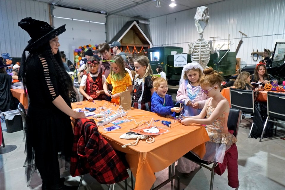 Many kids gathered for crafts at the Settlement Workers in Schools (SWIS) table.                               