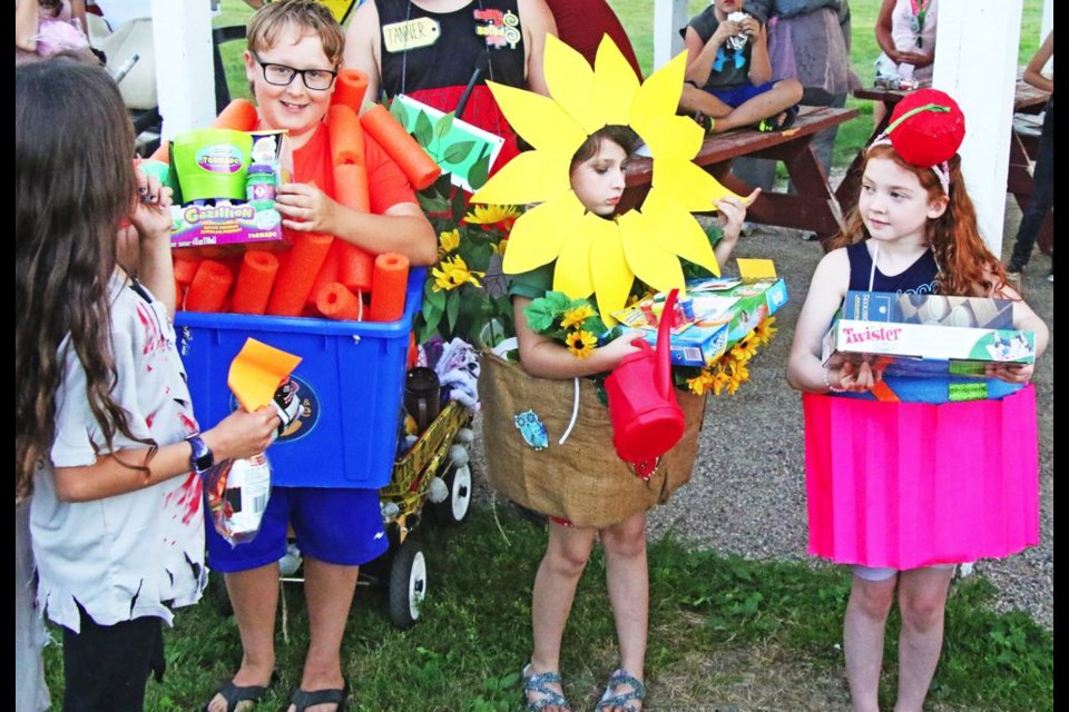 These three were judged as the best overall costumes at Halloween in the Park on Saturday. First place was Piper McCoy, at far right, as a cupcake; Scarlett Koller, in the middle, was a potted sunflower; and at left was Braxton Wallin as mac-and-cheese.