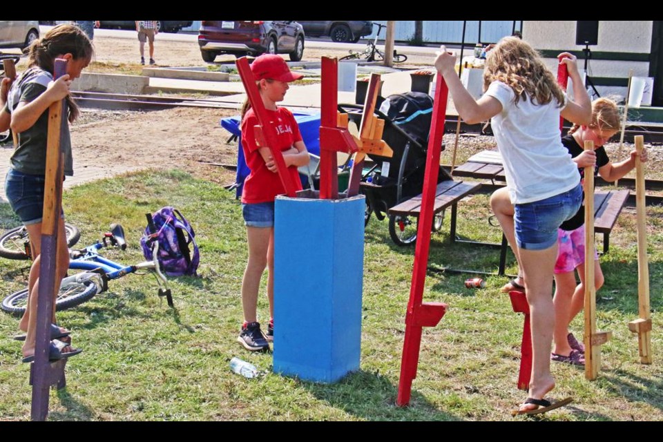 Walking on stilts was one of the old-fashioned activities available for families to try at Radville's Heritage Day on Saturday.