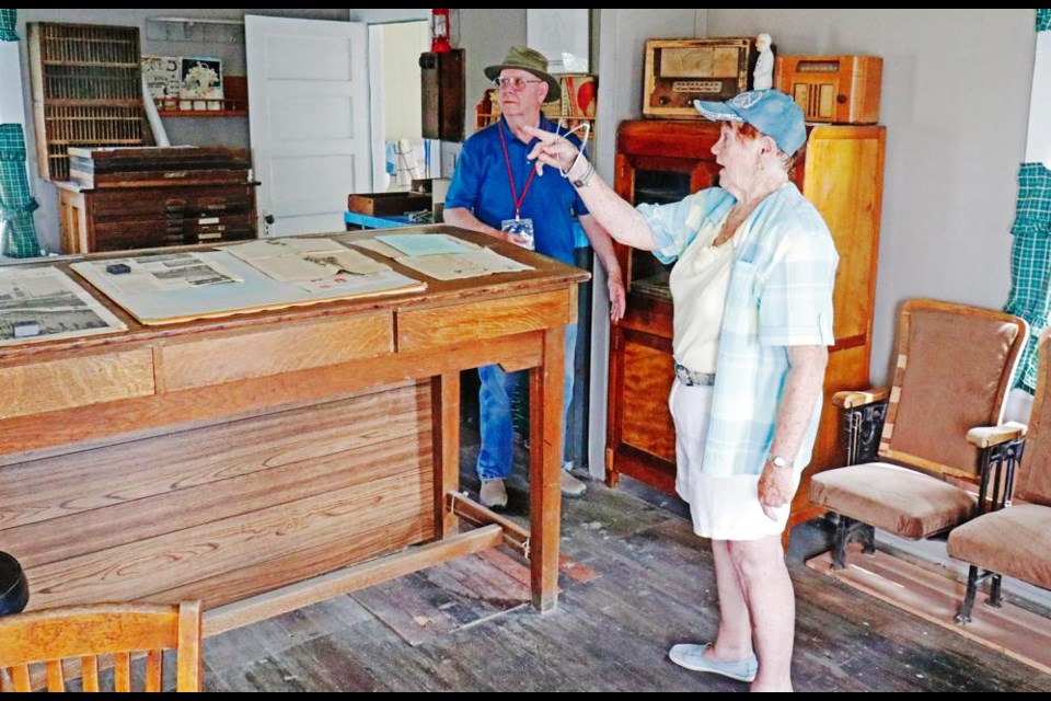 Gladys Paulhus pointed out where things used to be in the home she grew up in near Froude, as Bev Culbertson listened, during Heritage Village Days in Weyburn.