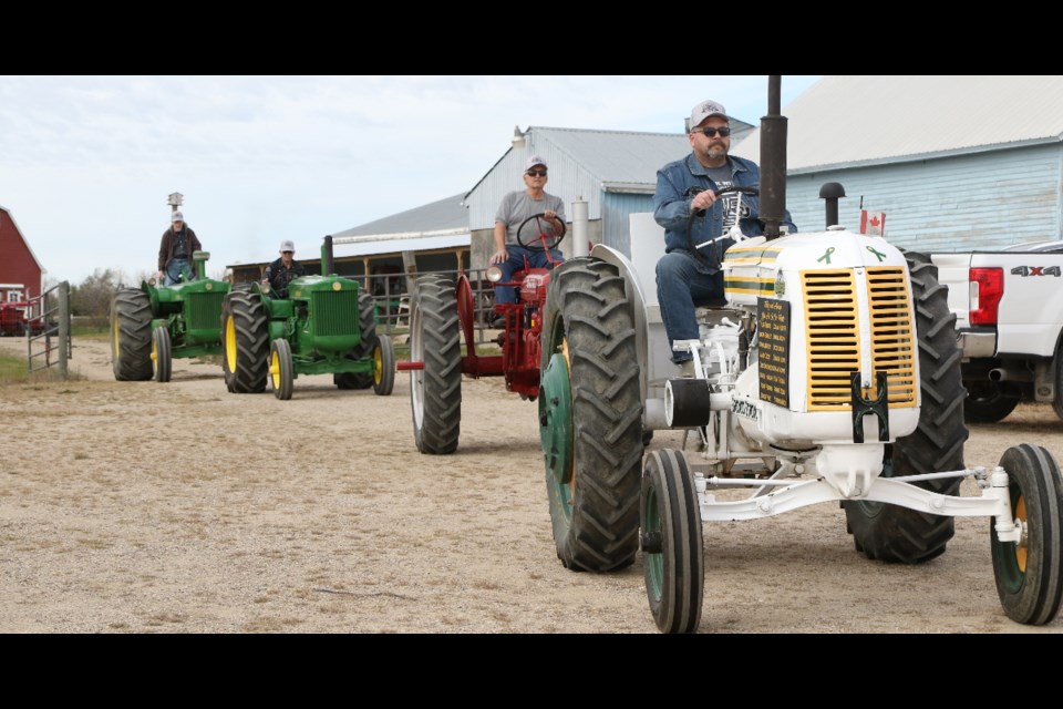 Members of the Humboldt Vintage Club took their vintage tractors for a spin, traveling to Muenster and back.