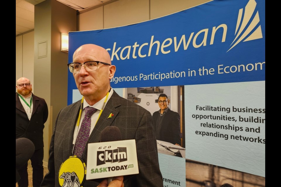 Trade and Export Development Minister Warren Kaeding speaks to reporters during a media scrum.