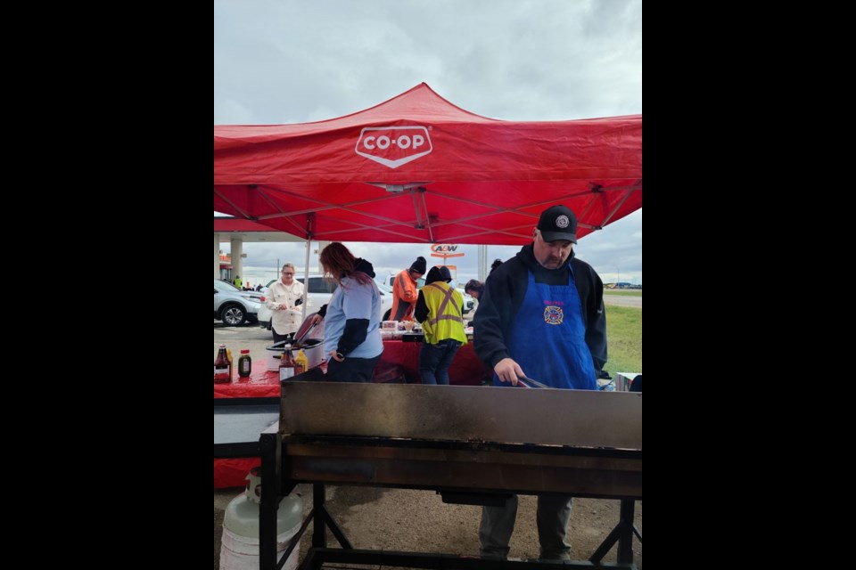 Delta Co-op team member, Jeremy Thompson, who also serves as Unity Fire Department Deputy Chief, was tasked with cooking for the fundraising event Sept. 20.