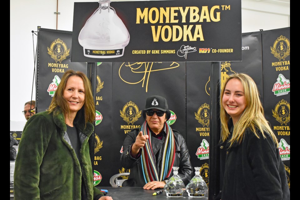 Rema Buschow, right, and her mom Carmen pose for a photo with Gene Simmons.