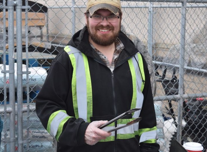 Peter Regehr was in charge of the barbecue at the hot dog fundraiser held at Gateway Co-op in Canora on April 23. Regehr and other members of Yorkton New Generation Lions Club were raising funds toward the goal of chartering a new Canora Lions Club. 