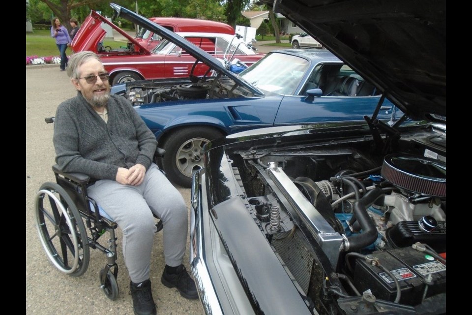 Tim Pollock, a resident of the Canora Gateway Lodge, is pictured exploring the many cars on display at the Canora Gateway Lodge Antique Car Show held on August 11. The event featured 18 vehicles. 