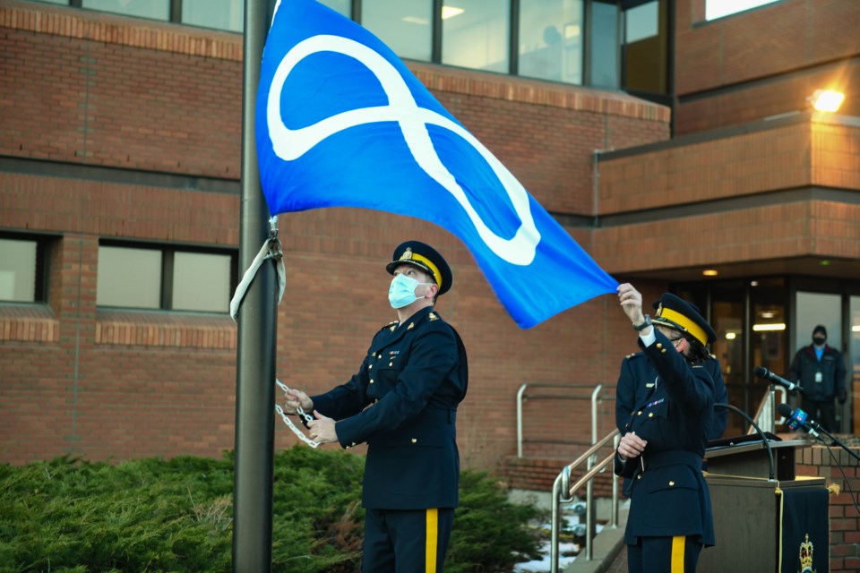 Three Saskatchewan RCMP depots replaced their ensign flags with the Métis Nation flag, pictured here at the Regina ceremony, to honour Louis Riel Day on Nov. 16.