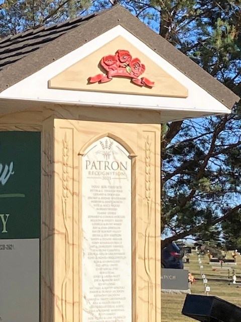 A close up of the side of this newly unveiled sign at Unity Cemetery shows a list of patrons as well as the poppy symbol for veterans and homesteaders.