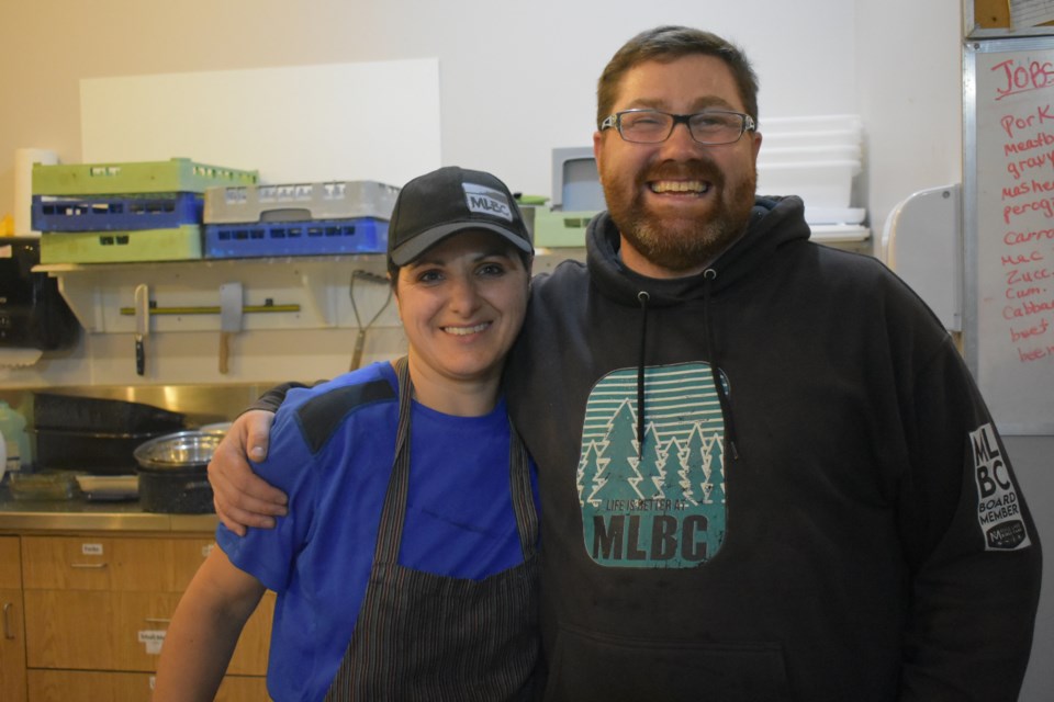 Keziah Campbell, left, one of the cooks of the event and Ryan Weisner, the camp counsellor