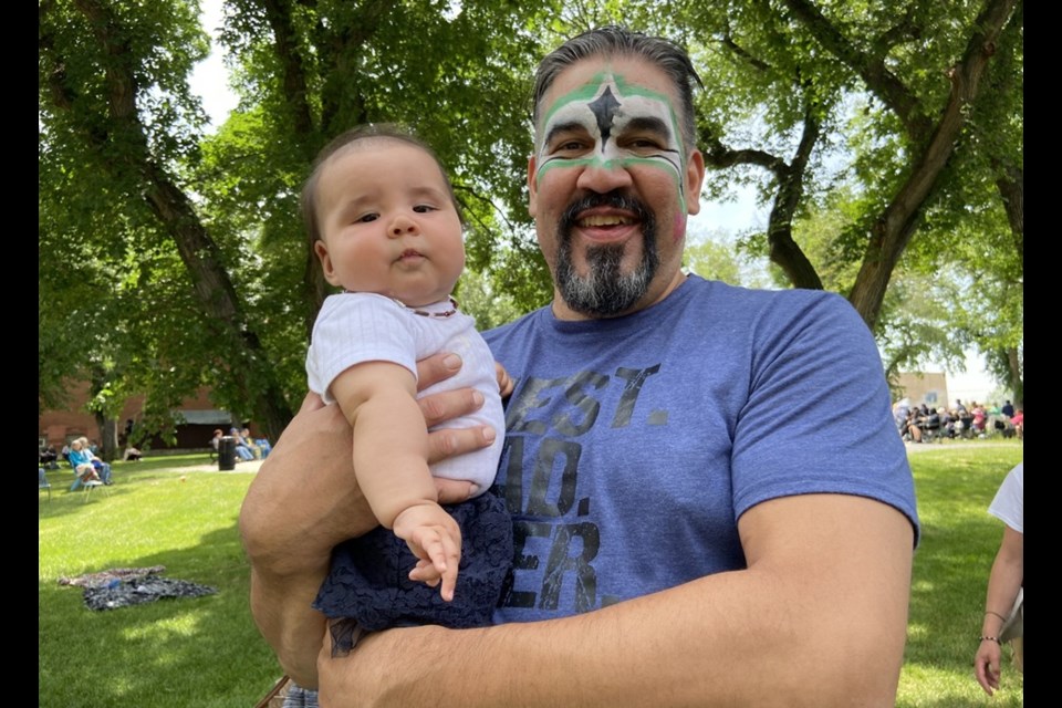 Toy Tootoosis enjoys the festivities with his daughter Mary-Beth Yutin Tootoosis.