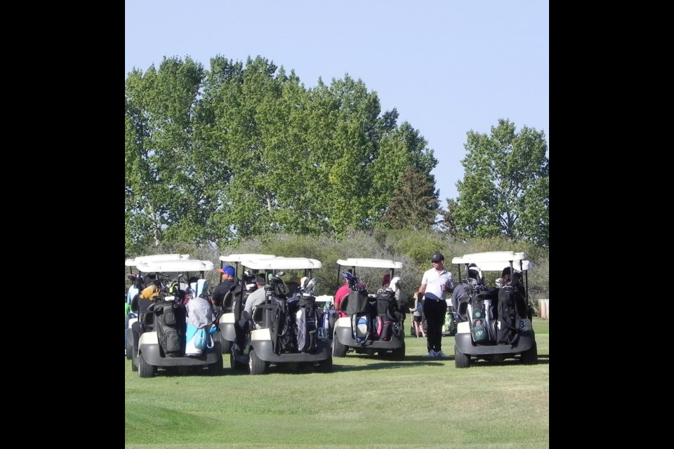 A congregation of golfers await their turn to play the next hole participating in the Unity Miner's Fun Day of Golf fundraiser Sept. 10.